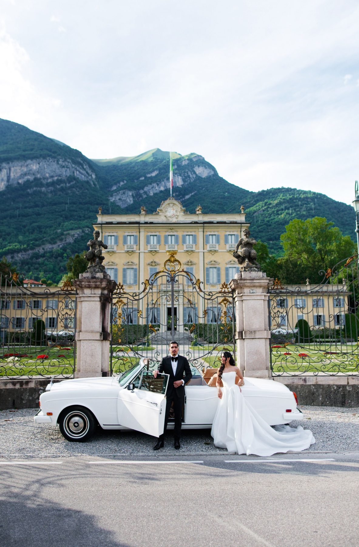 The villa and the classic car with the mountains behind